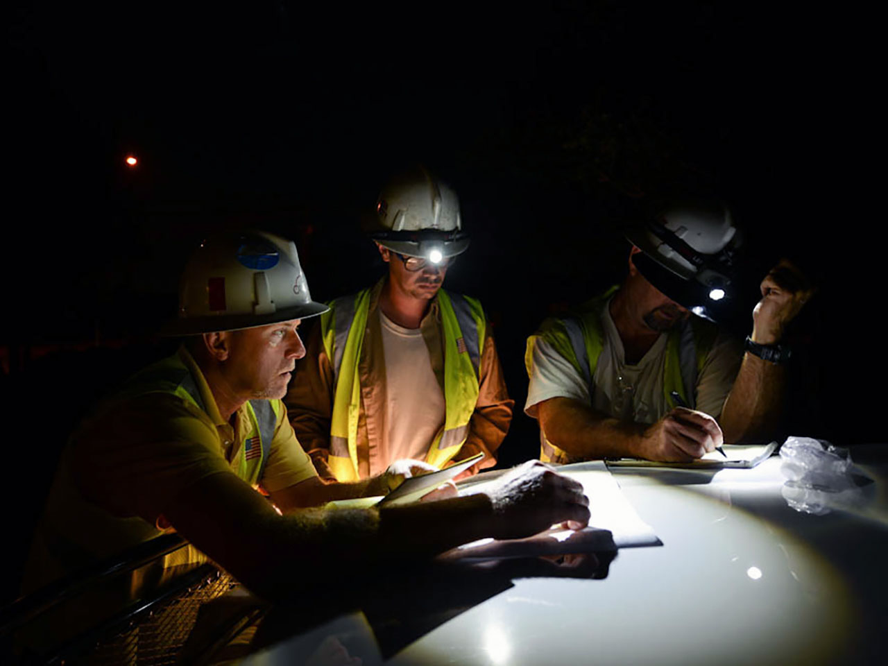 An Oncor restoration team meets at the scene of an outage following a storm to restore power safely and quickly.