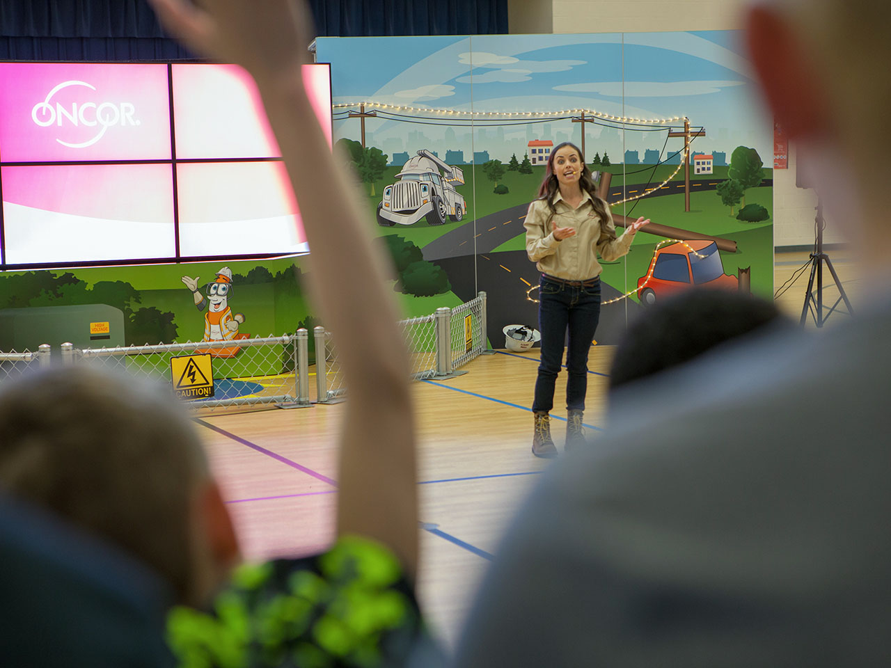 Texas grade-schoolers learn all about electrical safety during the fun Super Safe Kids roadshows with Oncor team members.